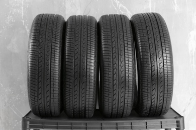 Car tires on grey background