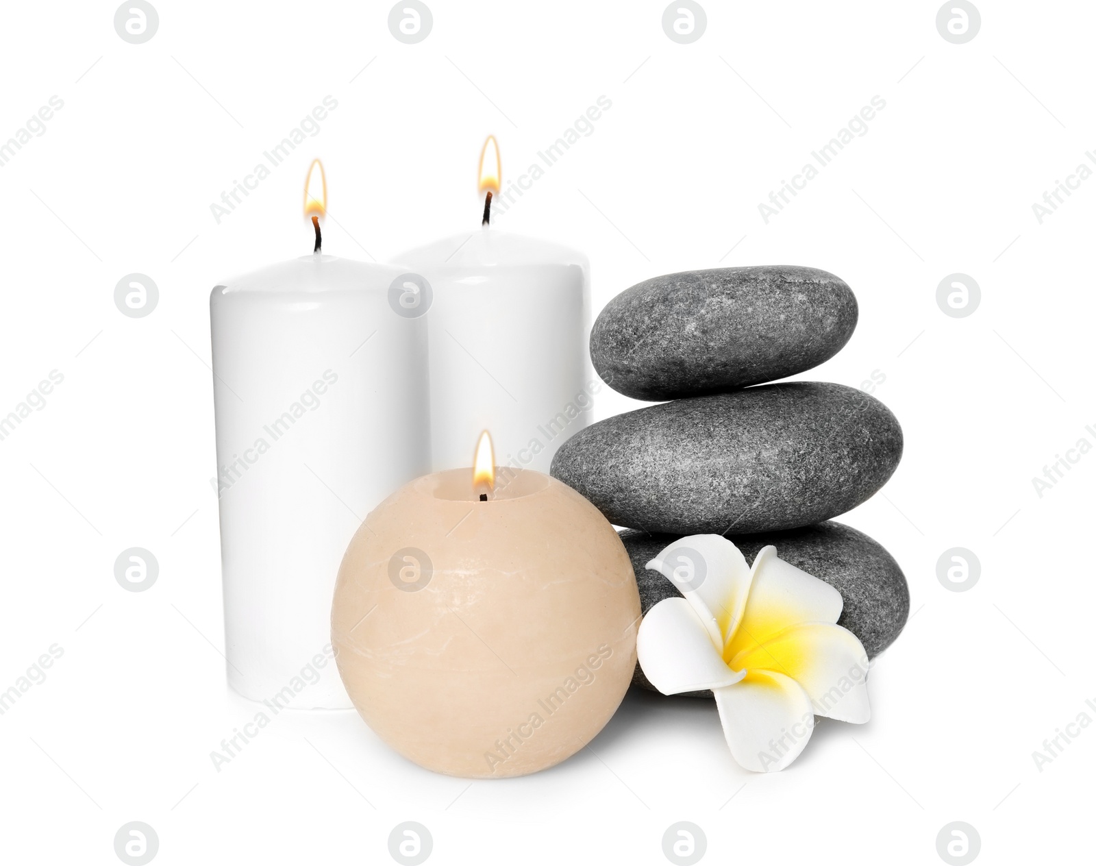 Photo of Beautiful spa composition with candles and stones on white background