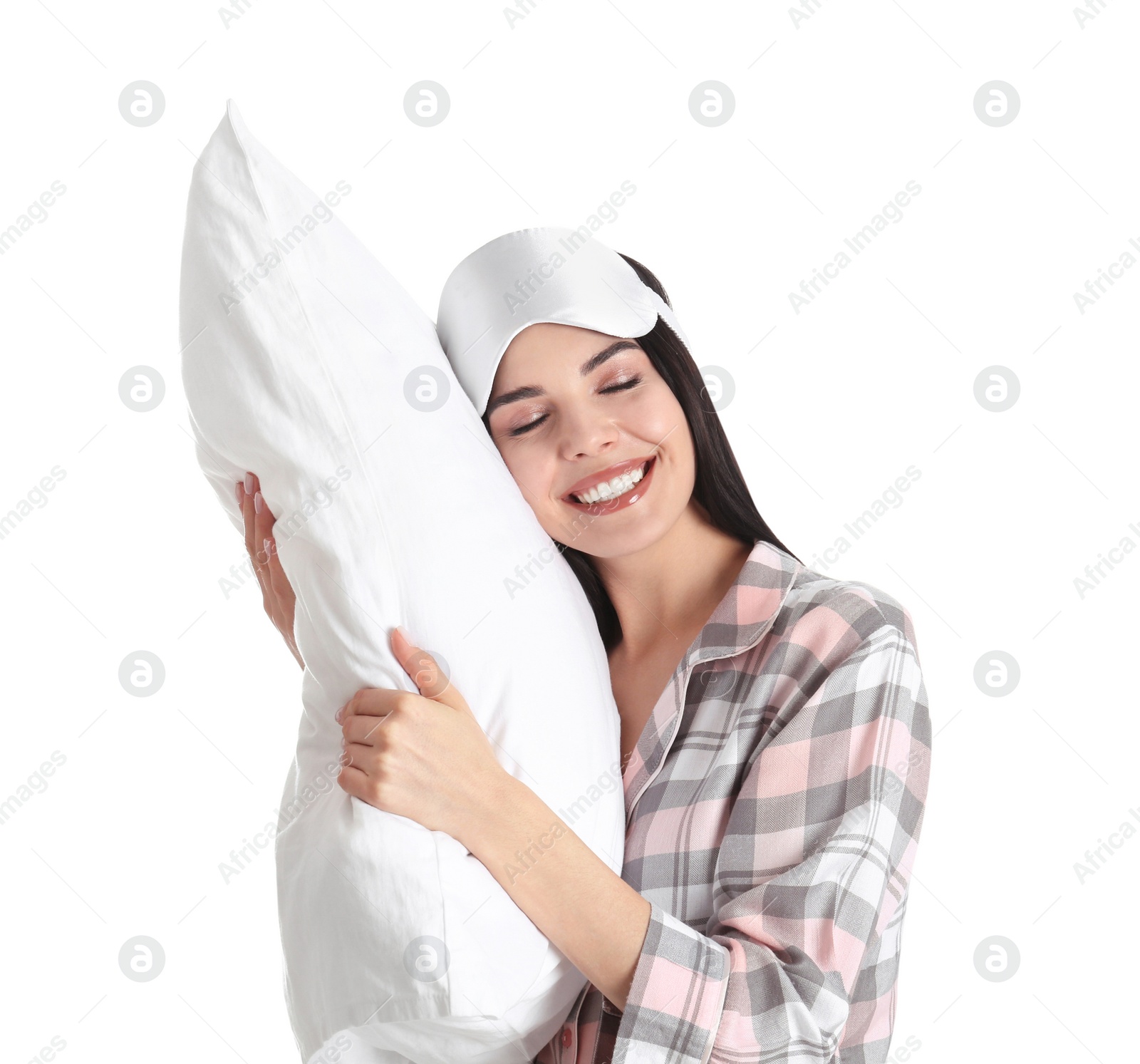 Photo of Young woman with pillow and sleep mask on white background