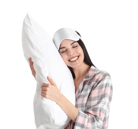 Young woman with pillow and sleep mask on white background