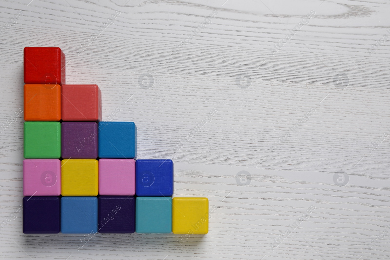 Photo of Many colorful cubes on white wooden background, flat lay with space for text. Management concept