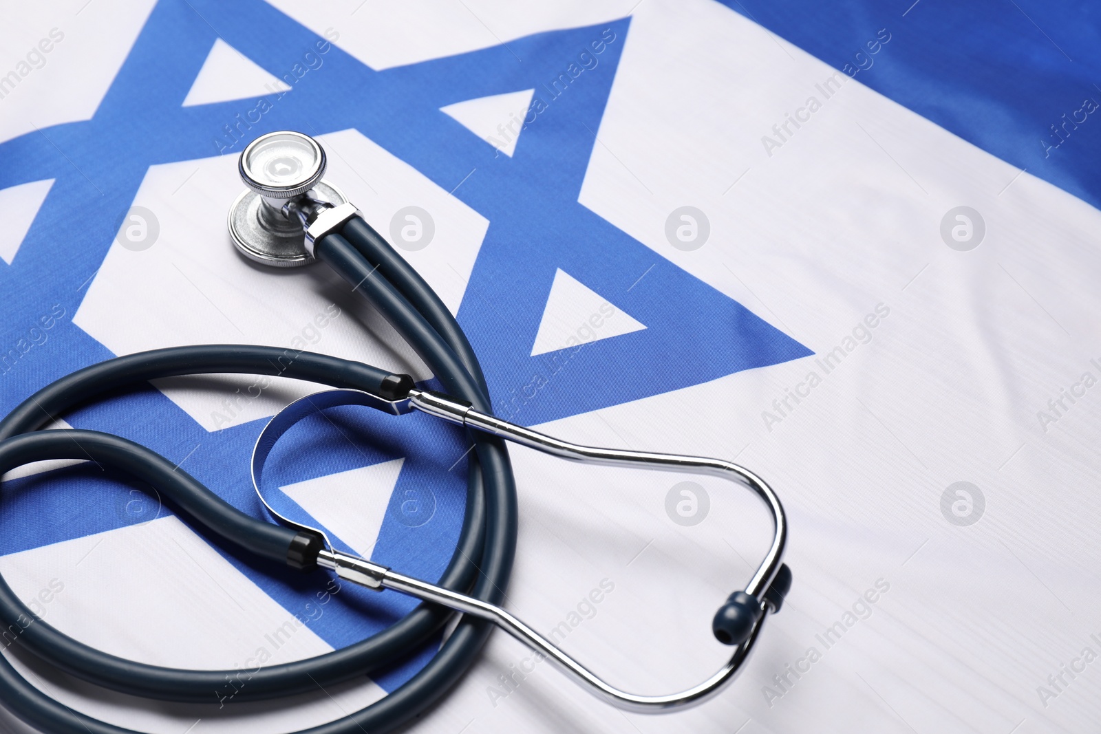 Photo of Stethoscope on flag of Israel. Health care concept