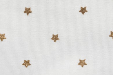 Texture of white fabric with stars as background, top view