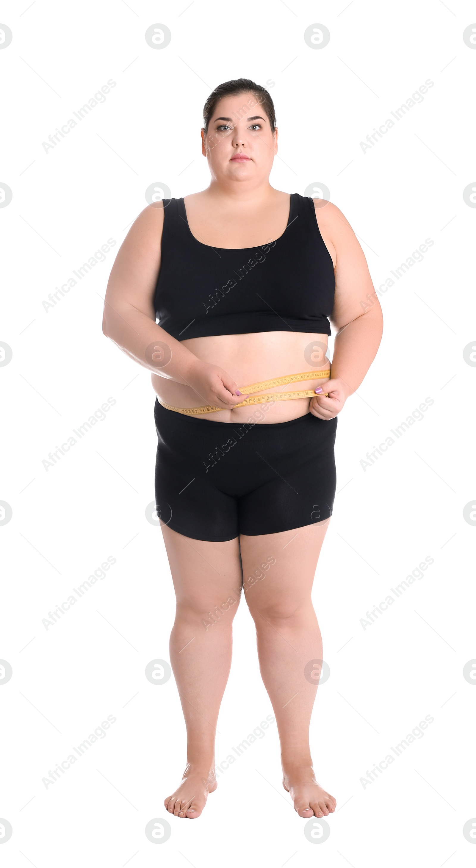 Photo of Overweight woman measuring waist before weight loss on white background