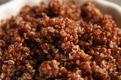 Cooked red quinoa in bowl, closeup view