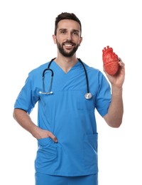 Doctor with stethoscope and model of heart on white background. Cardiology concept