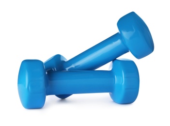 Photo of Color dumbbells on white background. Home fitness