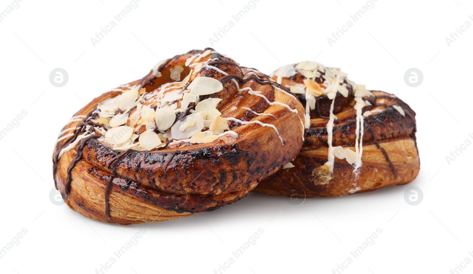 Photo of Delicious rolls with almond and toppings isolated on white. Sweet buns