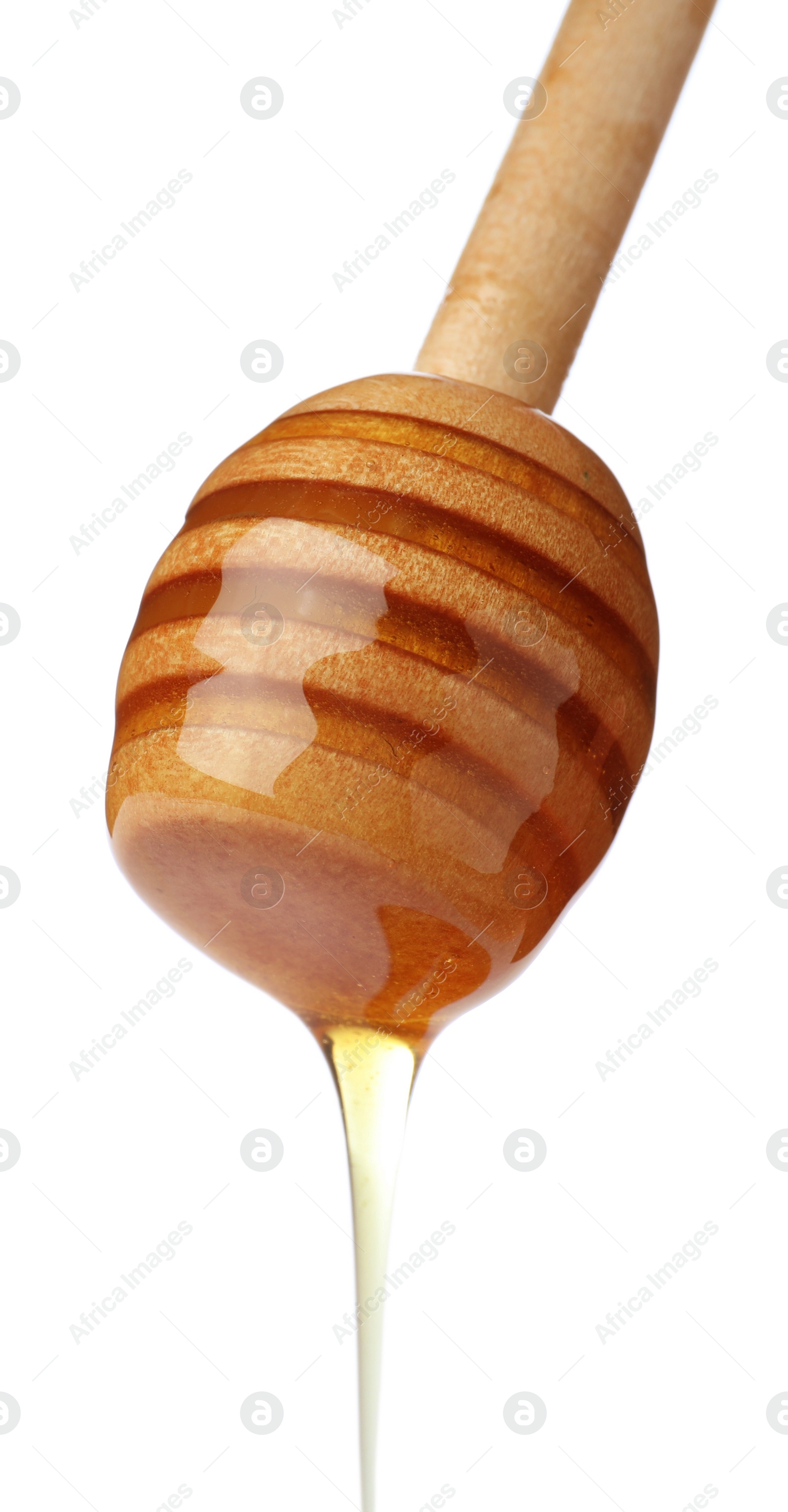 Photo of Honey dripping from dipper on white background