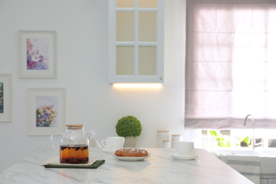 Photo of Breakfast served on table in modern kitchen, space for text. Interior design