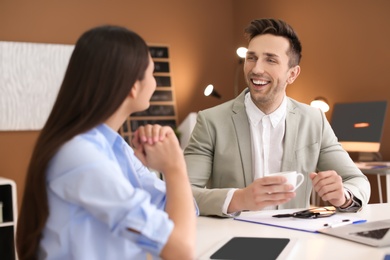 Photo of Human resources manager conducting job interview with applicant in office