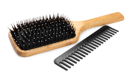 New wooden hair brush and comb isolated on white