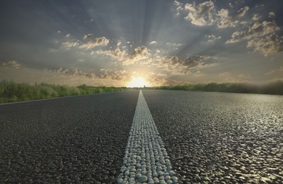 Image of Empty asphalt road at sunrise, closeup view