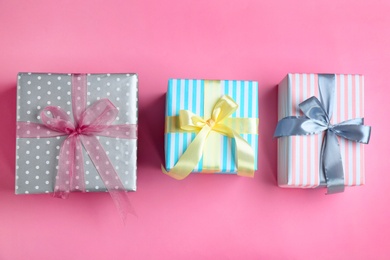 Different gift boxes on color background, flat lay