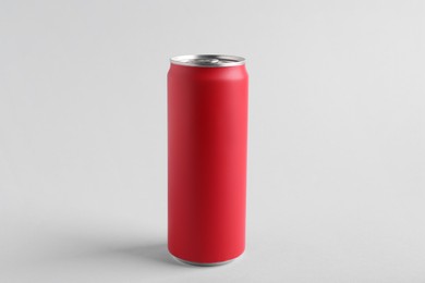 Photo of Energy drink in red can on white background