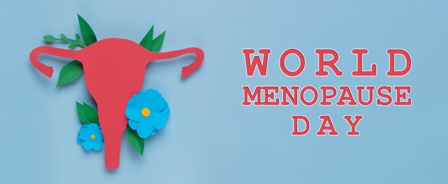 World Menopause Day, banner design. Paper uterus and flowers on light blue background, top view