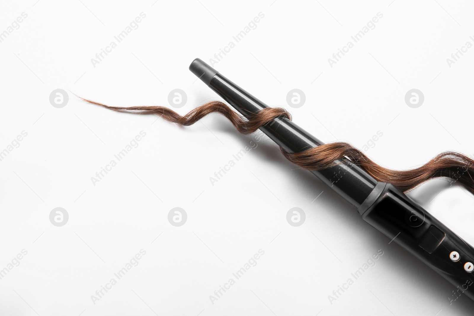 Photo of Modern clipless curling iron and brown hair lock on white background