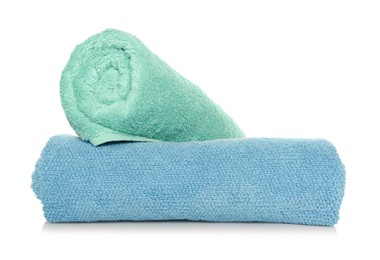 Rolled soft terry towels on white background