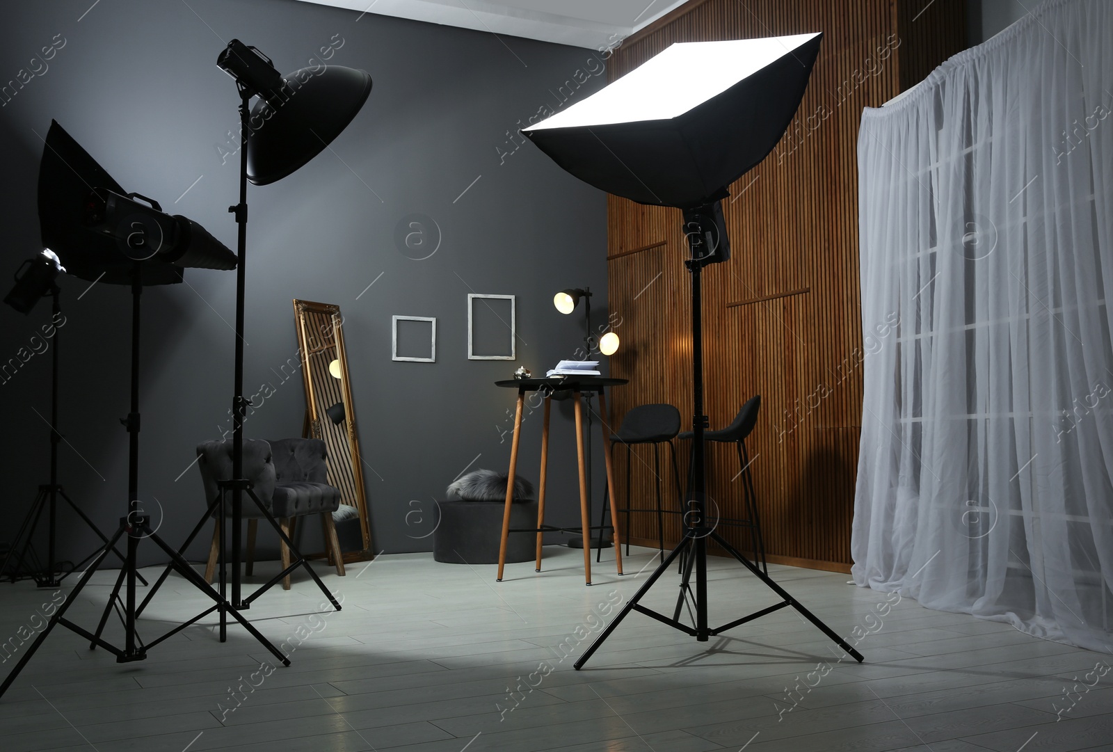 Photo of Example of living room interior design and professional equipment in photo studio