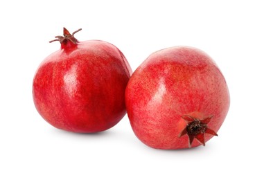 Photo of Two fresh ripe pomegranates isolated on white