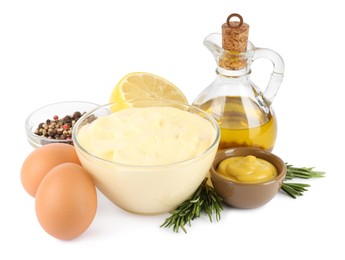 Photo of Delicious homemade mayonnaise, spices and ingredients on white background