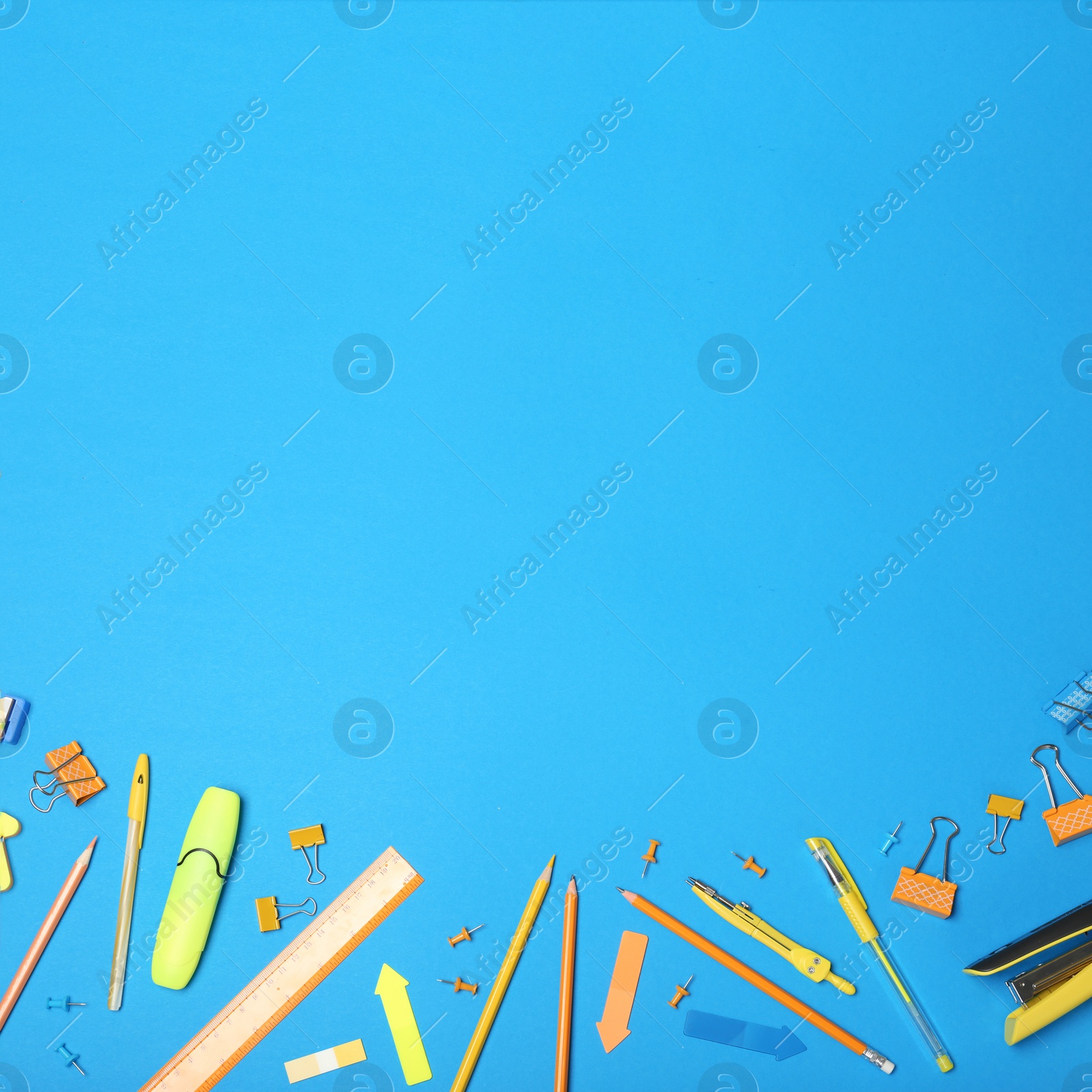 Image of Flat lay composition with different school stationery on blue background. Space for text