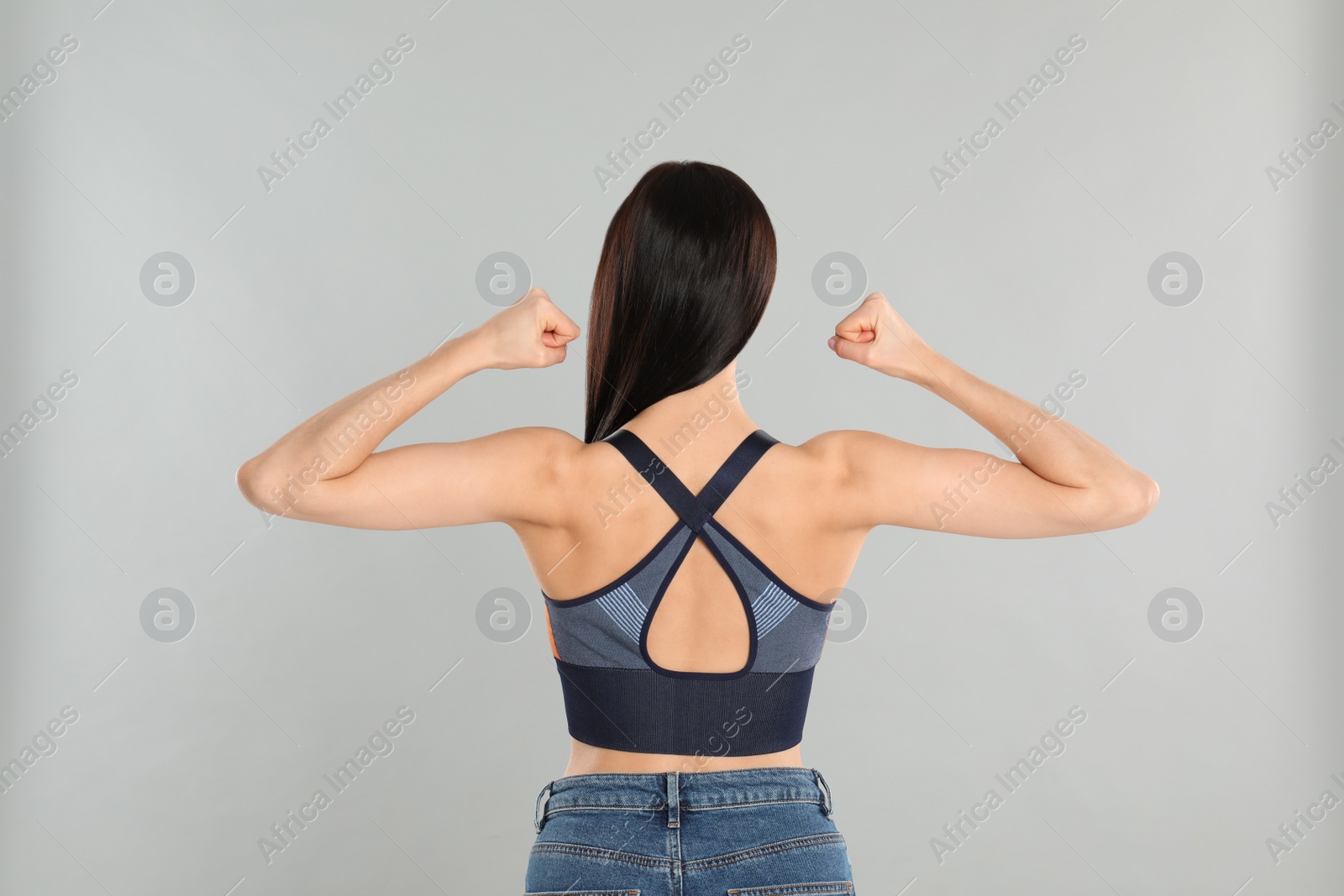 Photo of Woman with healthy back on light grey background. Visiting orthopedist