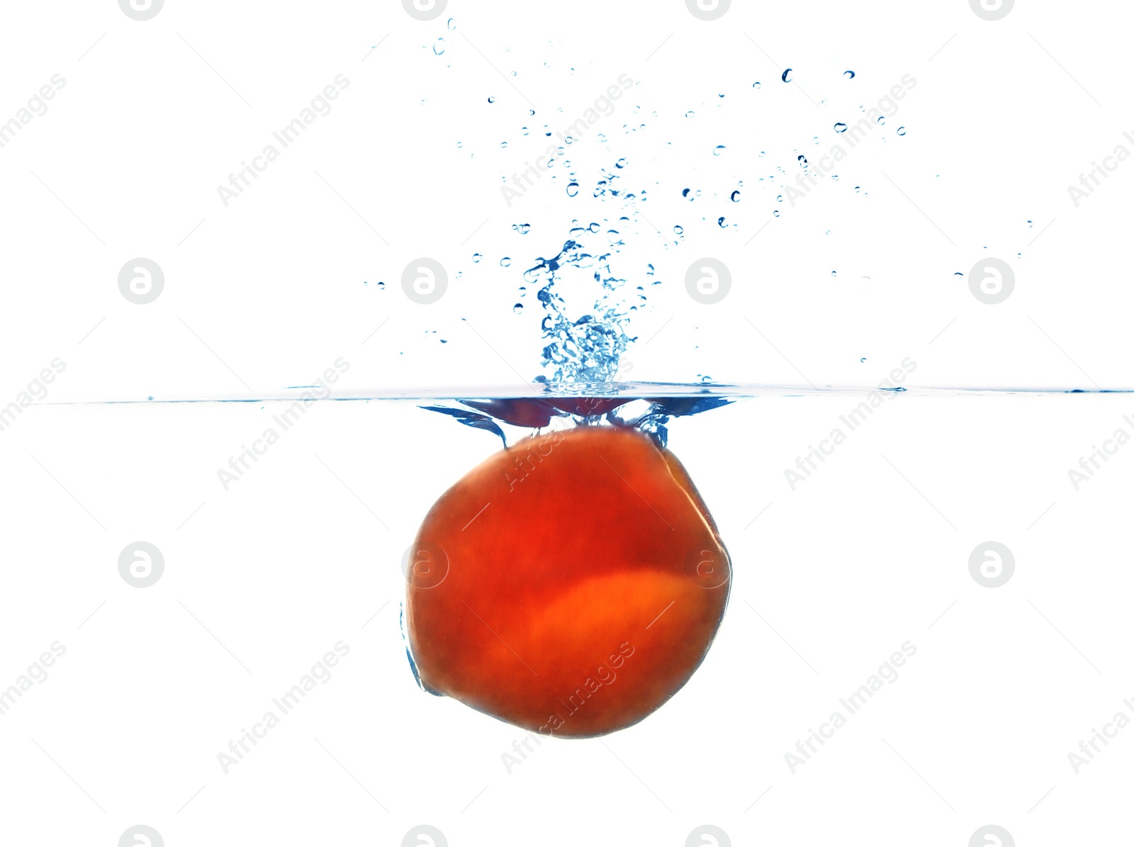 Photo of Fresh ripe peach falling in water on white background