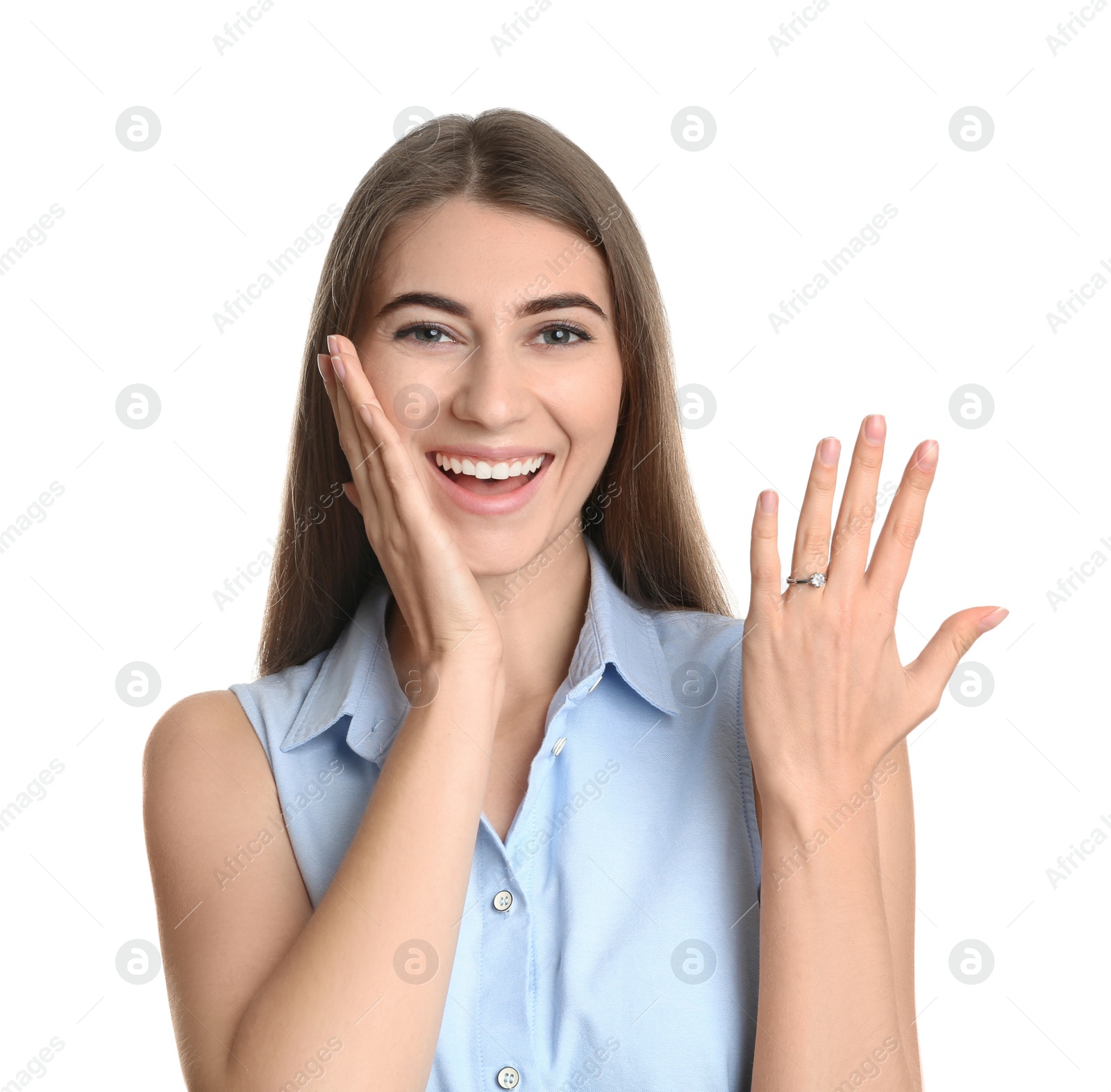 Photo of Happy young woman wearing beautiful engagement ring on white background