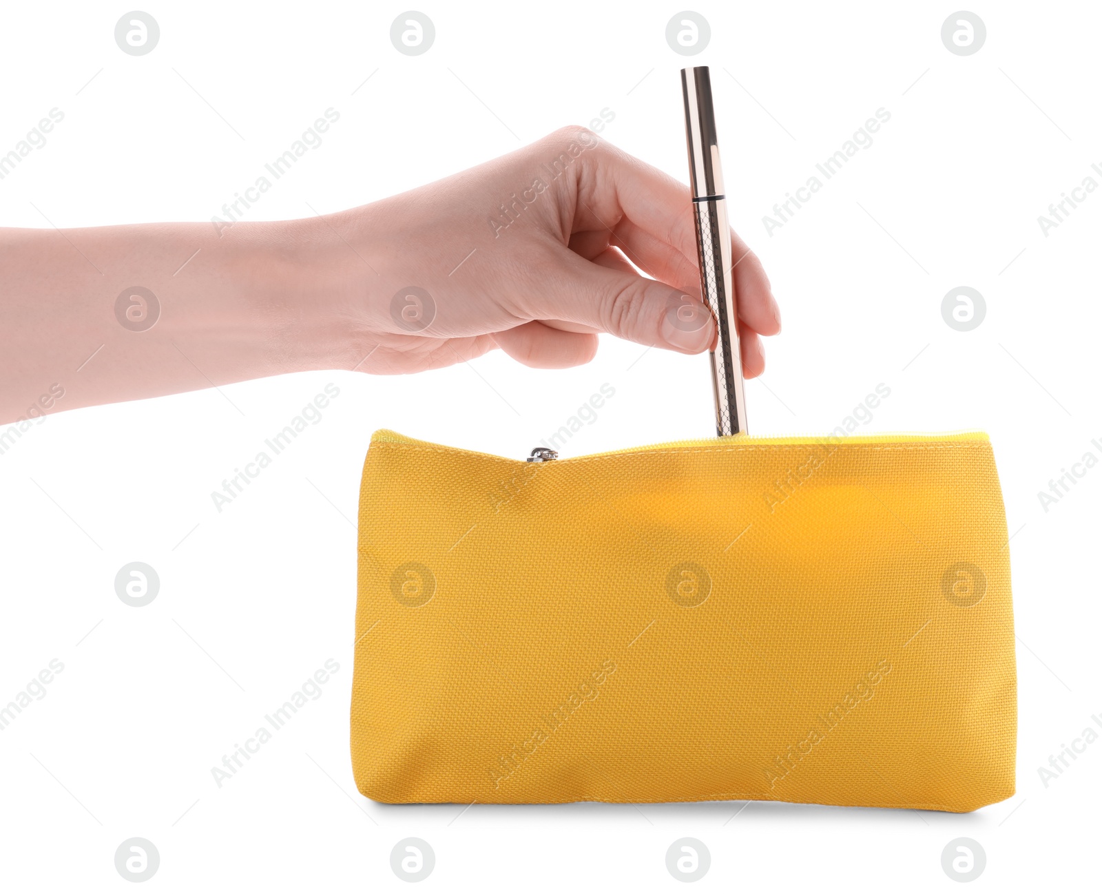 Photo of Woman taking out eyeliner from yellow cosmetic bag on white background, closeup