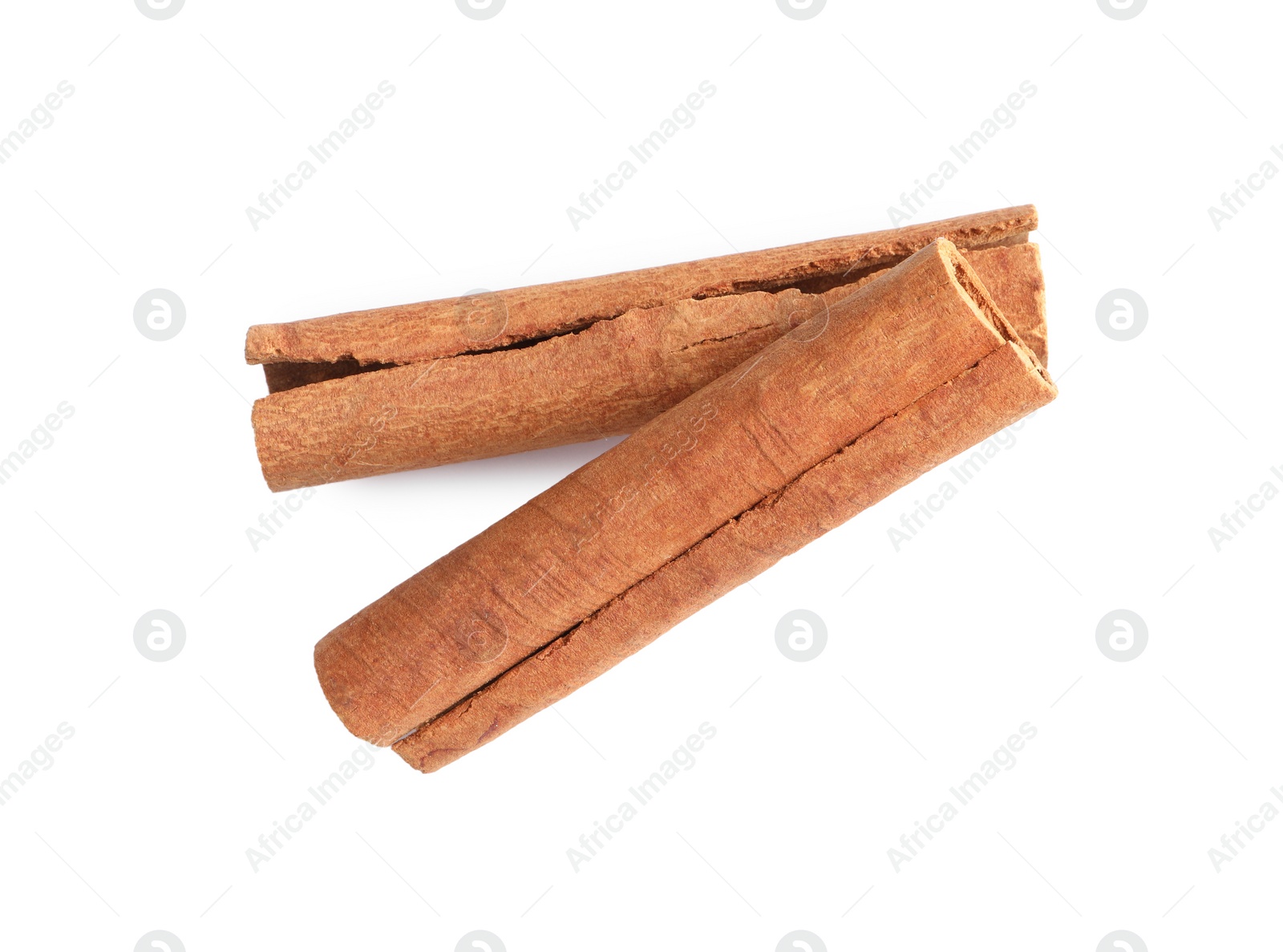 Photo of Cinnamon sticks isolated on white, top view