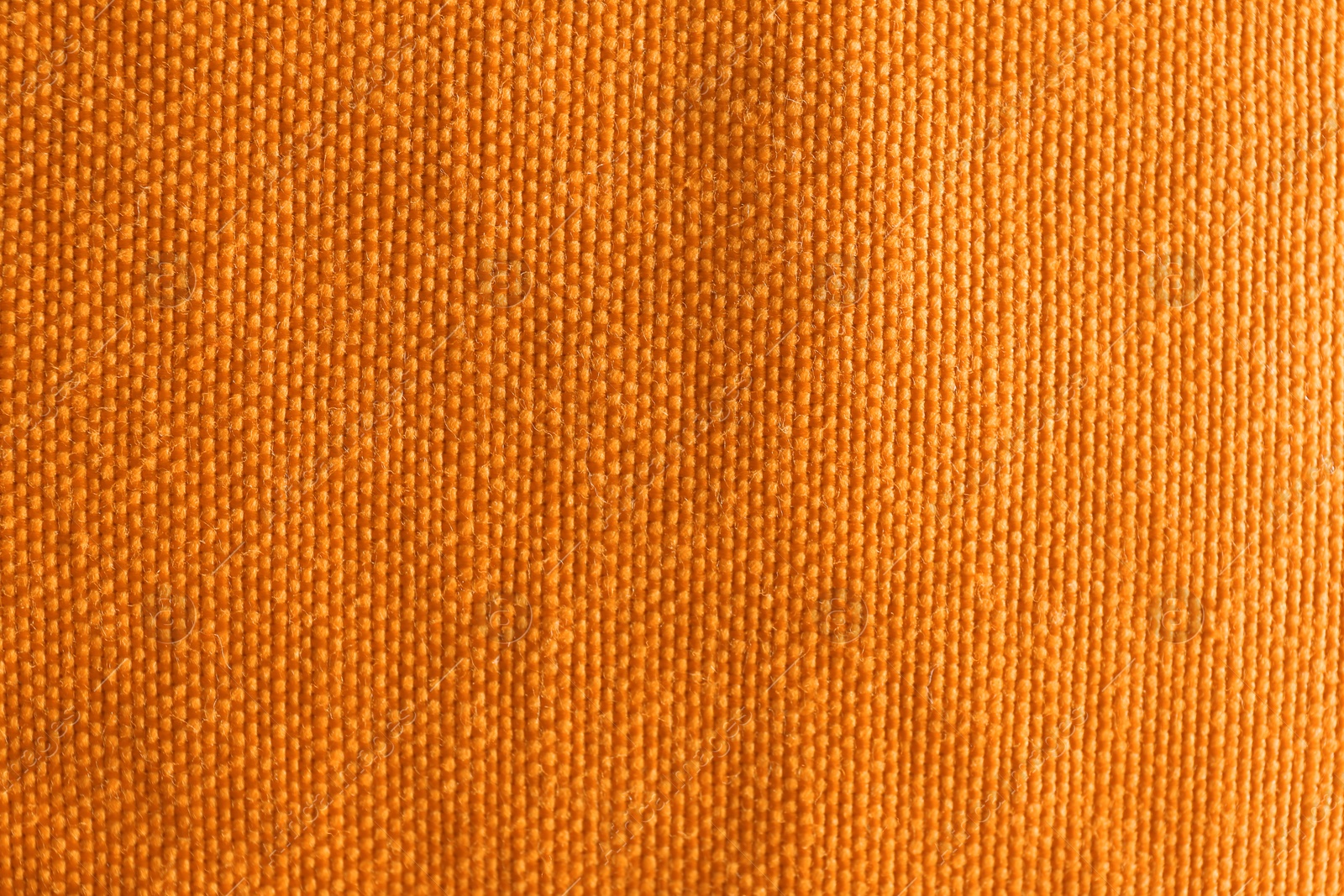 Photo of Orange textured fabric as background, top view