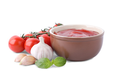 Photo of Delicious tomato sauce and ingredients on white background