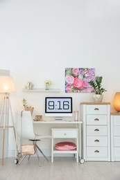 Photo of Comfortable workplace with computer on desk in home office