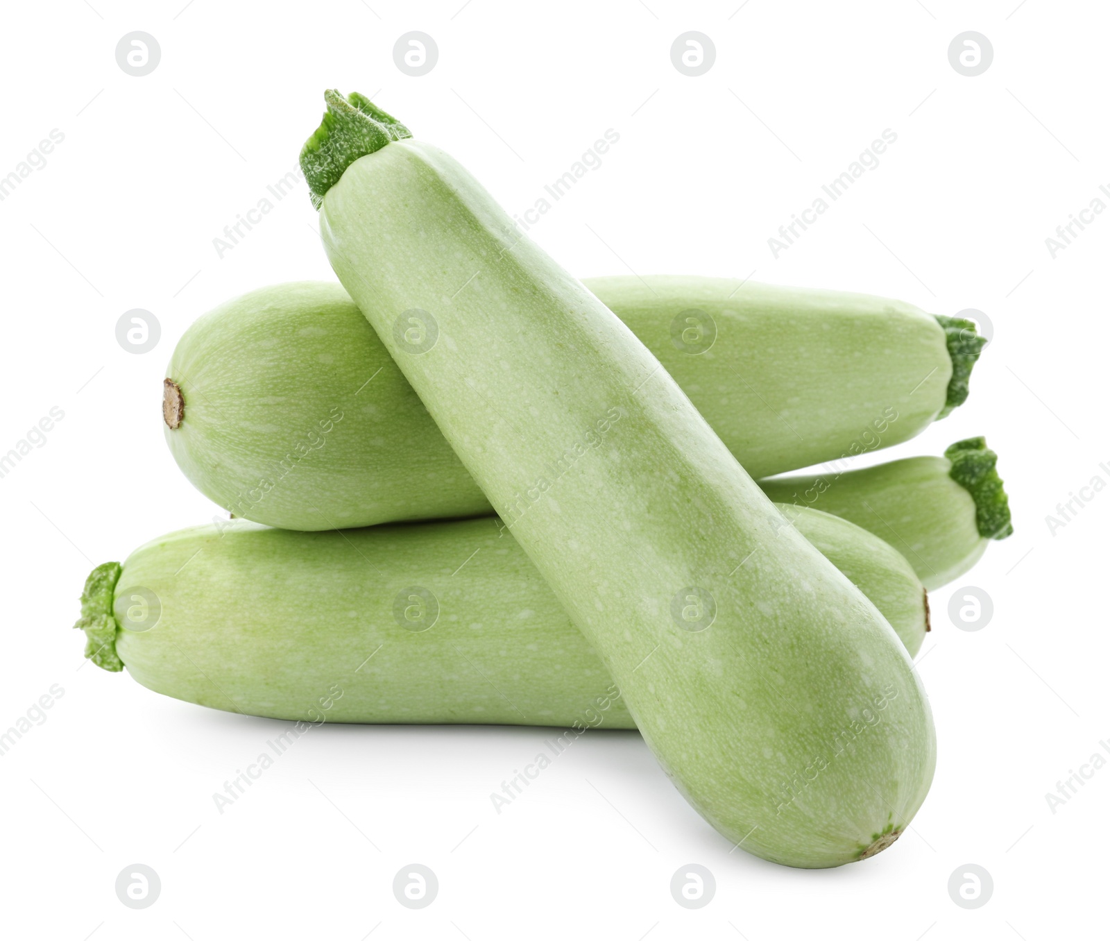 Photo of Fresh ripe zucchini squashes on white background