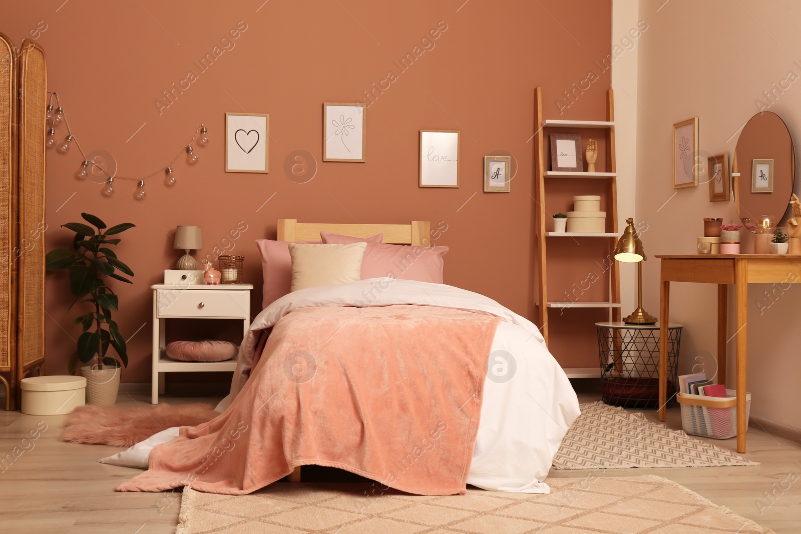 Photo of Teenage girl's bedroom interior with stylish furniture and beautiful decor elements