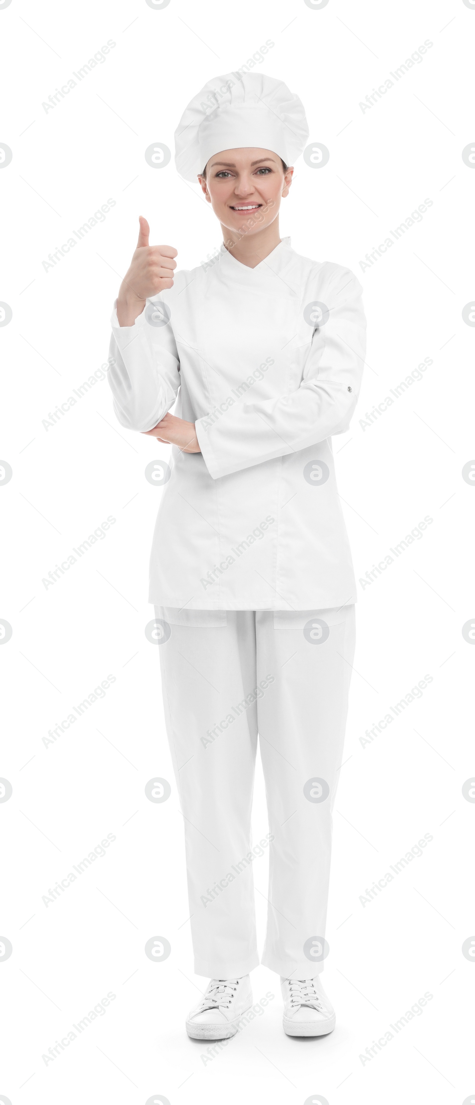 Photo of Happy woman chef in uniform showing thumbs up on white background