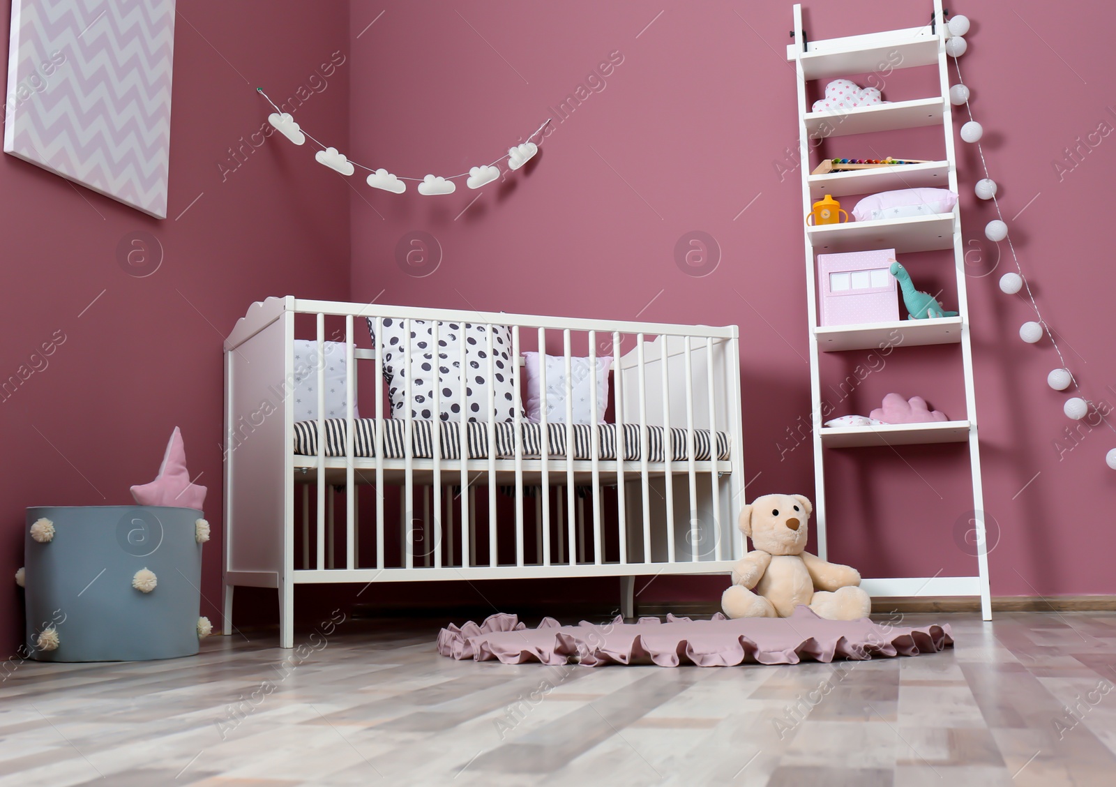 Photo of Stylish baby room interior with crib