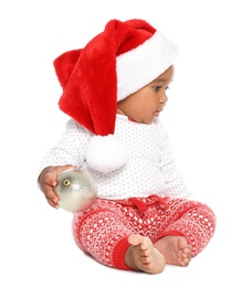 Photo of Festively dressed African-American baby with Christmas ball on white background