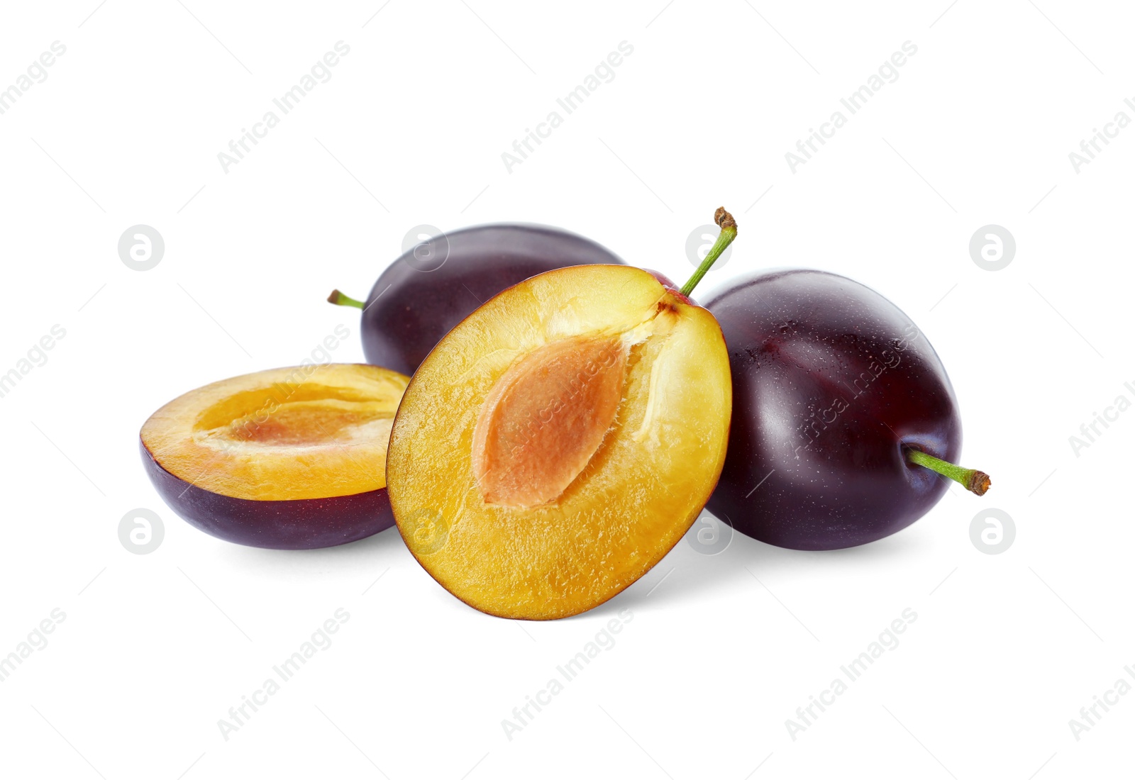 Photo of Whole and cut ripe plums on white background