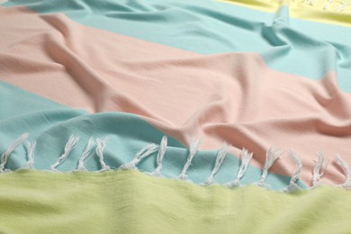 Photo of Crumpled colorful beach towel as background, closeup view