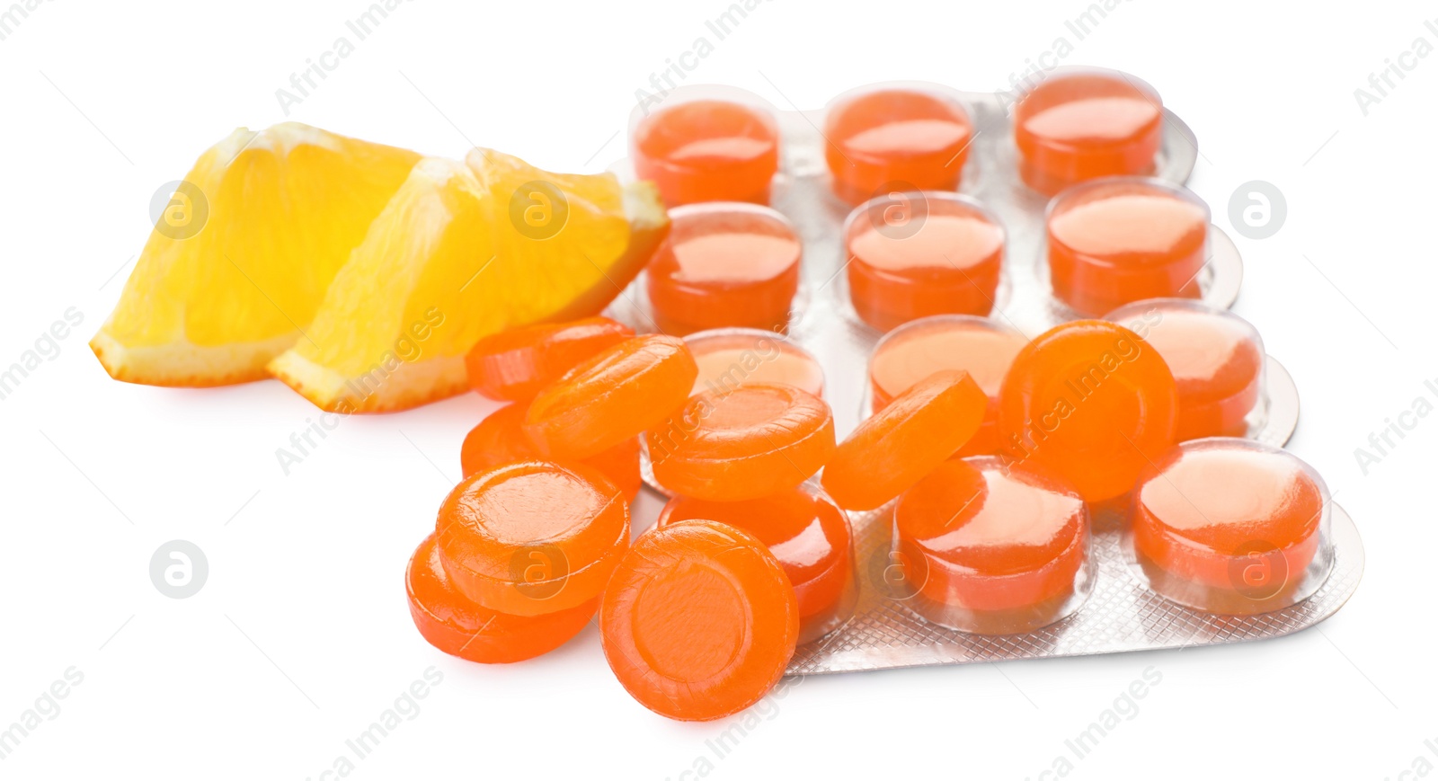 Photo of Many cough drops and orange on white background