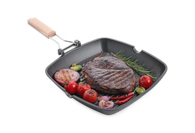 Grill pan with delicious fried beef meat, spices and vegetables isolated on white