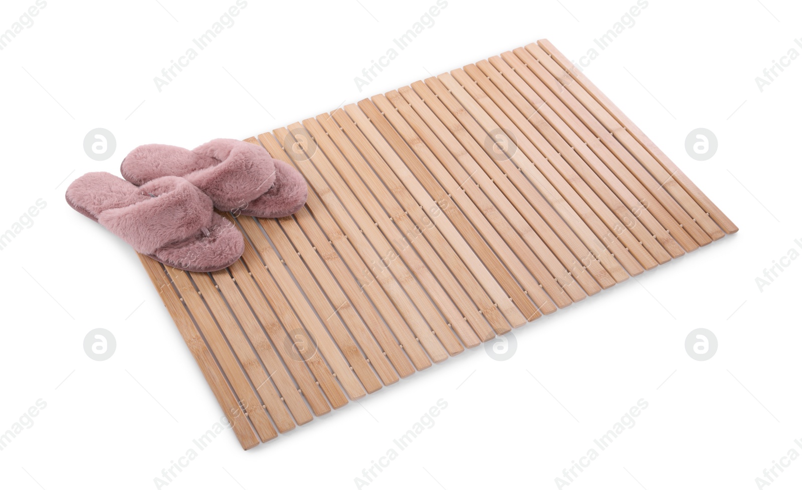 Photo of Bamboo rug with soft slippers isolated on white. Bath accessory