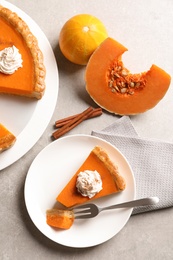 Photo of Flat lay composition with fresh delicious homemade pumpkin pie on table