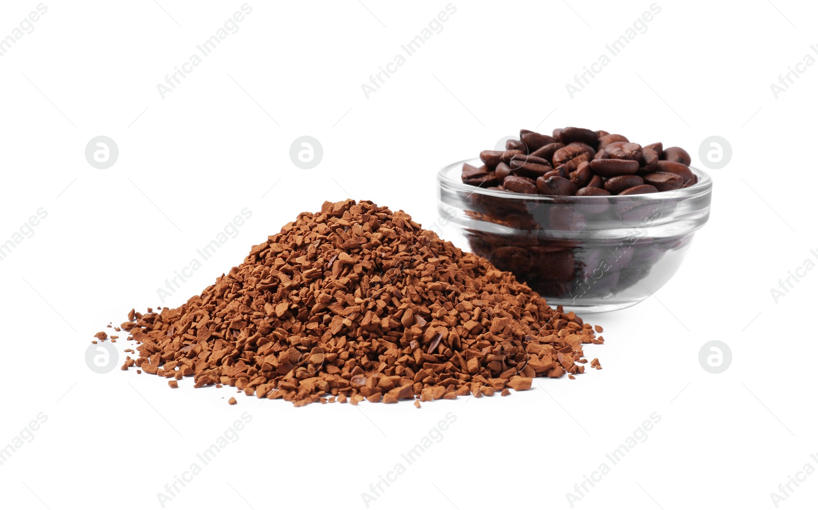Photo of Heap of instant coffee and glass bowl with beans on white background