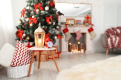 Photo of Blurred view of stylish living room interior with decorated Christmas tree