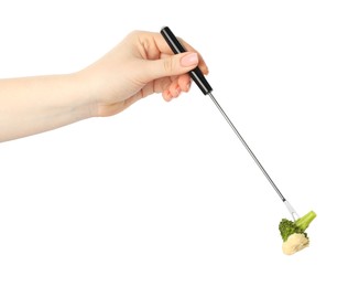 Photo of Tasty fondue. Woman holding fork with broccoli and melted cheese on white background, closeup