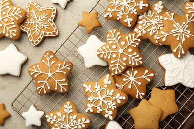 Photo of Tasty Christmas cookies with icing on light table, flat lay