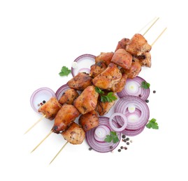 Photo of Delicious shish kebabs, onion, parsley and spices isolated on white, top view